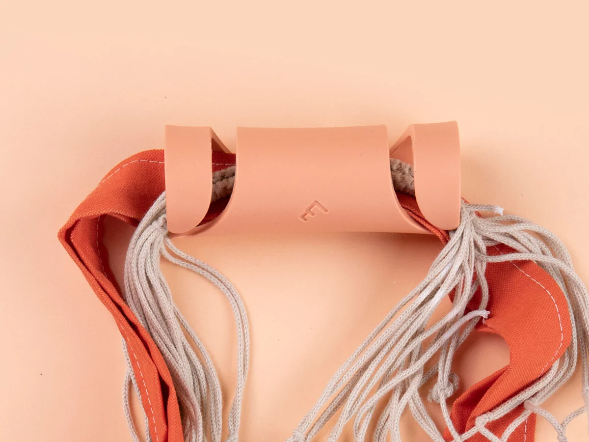 Carryfix portable handle designed by Formeta Design for carrying heavy bags and gloceries