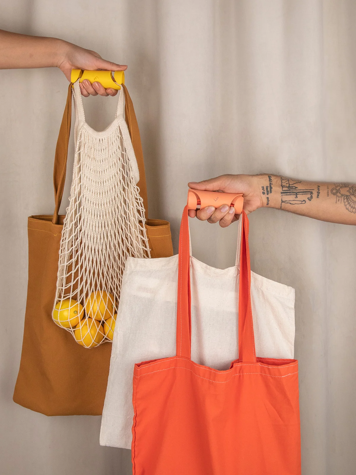 Carryfix portable handle designed by Formeta Design for carrying heavy bags and gloceries