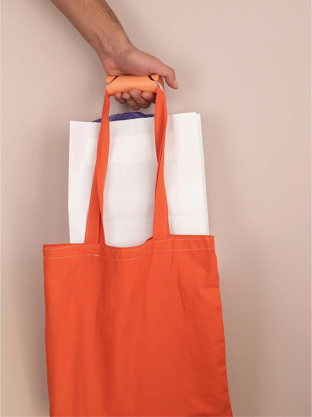 Carryfix portable handle designed by Formeta Design for carrying heavy bags and gloceries
